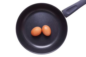 Eggs in Teflon Frying Pan Isolated on White Background.