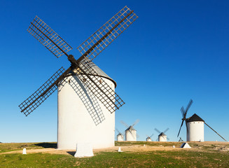 Fototapeta na wymiar Group of windmills in sunny day