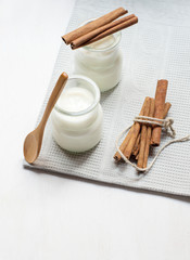 Two jar of yogurt with cinnamon