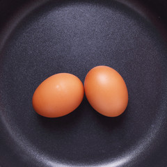 Two Hen Eggs on Pan for Background Uses.
