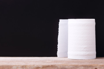 Roll of White Tissue Paper on Black Background. 