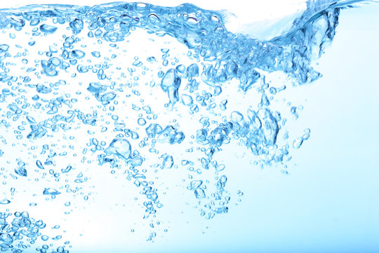 Water Splash with Bubbles of Air for Background Uses.