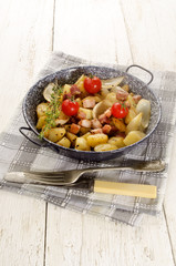 thyme potato and bacon in a pan