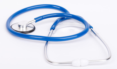 Blue stethoscope close-up on white background