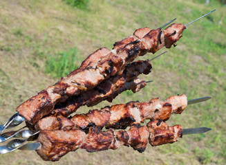 Grilling a delicious shashlik from marinated meat