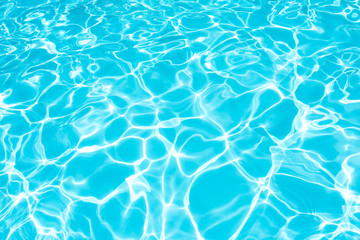 Pattern of blue water surface in swimming pool 
