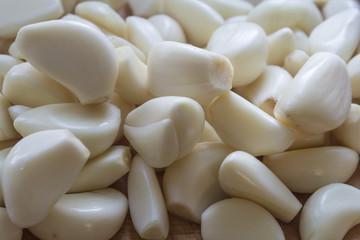 Peeled garlic cloves cooking