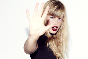 Fototapeta premium Angry refusal from young blond woman, portrait