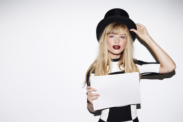 Beautiful blond in top hat with blank message
