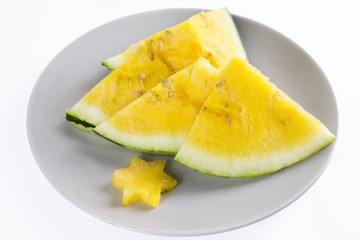 Yellow watermelon on a plate