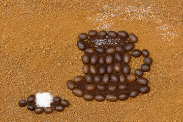 picture a cup of coffee and sugar cube on a  background from granulated coffee
