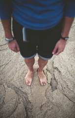 Details of bare feet in the sand