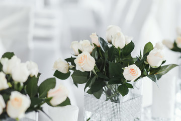 Wedding table with white roses.
