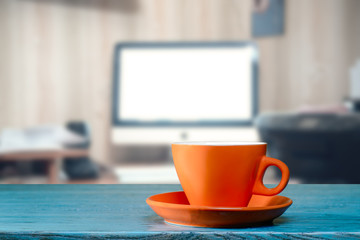Orange cup on office desk