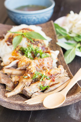 Noodles with pork and pork balls with Thai style on wooden plate