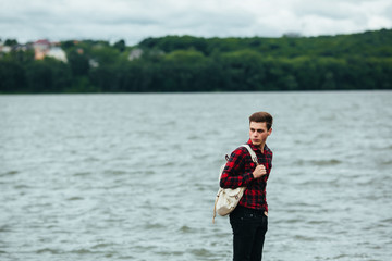 man standing on a pier