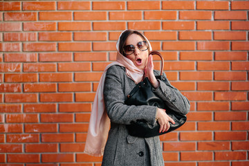 girl in a coat on the street