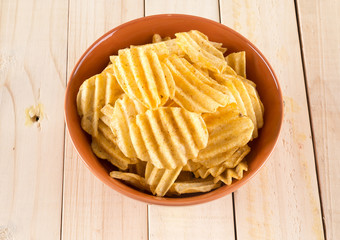potato chips on wood background