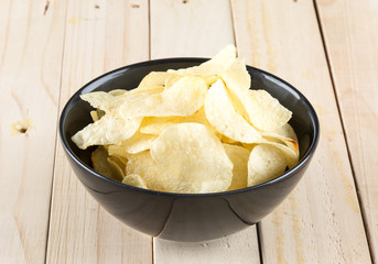 potato chips on wood background