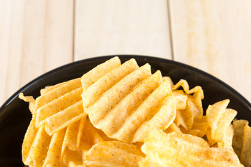 potato chips on wood background
