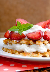 Belgian waffles with strawberries and cream