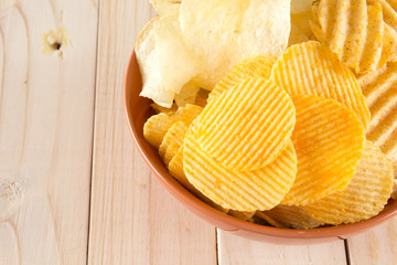 potato chips on wood background