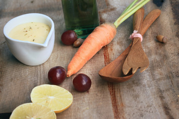 fresh red spinach salad and cream on wooden table