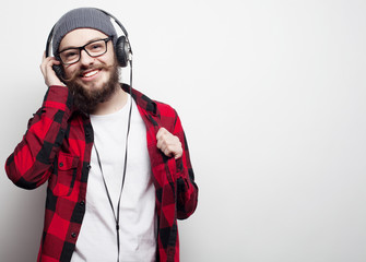  young bearded man listening to music