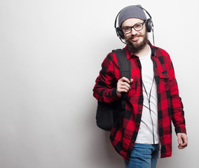  young bearded man listening to music