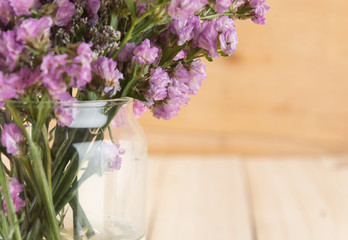 statice flower bouquet  on wood background