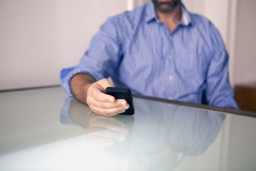 closeup of man holding a phone