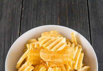 potato chips on wood background