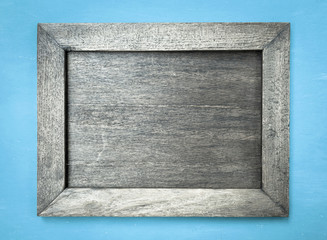 Retro style Wooden picture frame on blue background