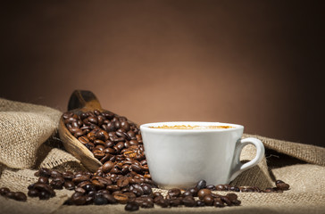 White cup with coffee beans