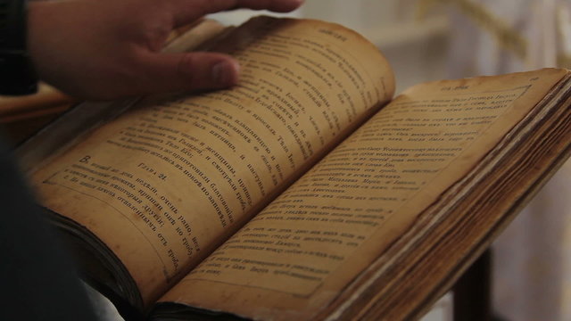 Old Russian Vintage Book Being Held and Looked Through 