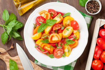 Fresh colorful tomatoes and basil salad