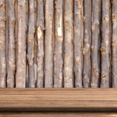 Vintage wood table in wood wall room.