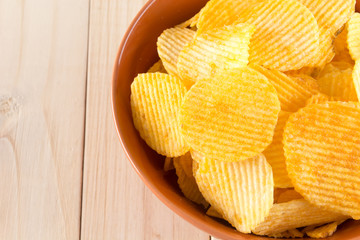 potato chips on wood background