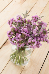 statice flower bouquet  on wood background