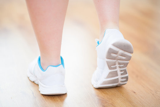 legs in sport shoes