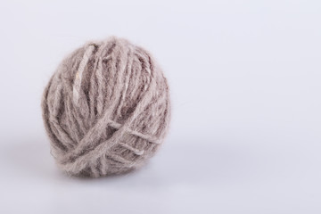 Persian cat raw wool yarn coiled into a ball