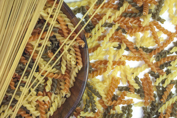 Various mix of pasta in wooden bowl