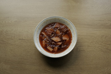 Beets soup on the wooden background