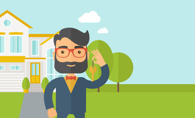Man holding a key infront of the house