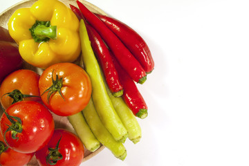 Mixed collection of fresh organic vegetables for healthy vegetarian food isolated on a white background.