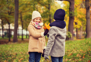 smiling children in autumn park