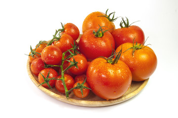 Fresh organic tomatoes isolated on white background