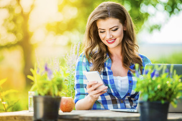 Beautiful young woman gardening