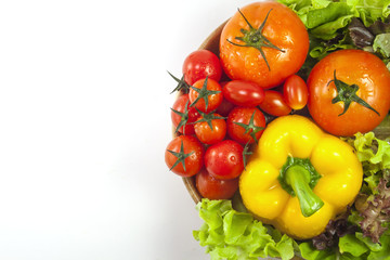 Mixed collection of vegetables isolated on a white background. Bowl of salad with fresh organic vegetables for healthy.