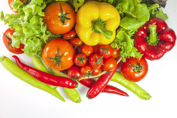 Mixed collection of vegetables isolated on a white background. Bowl of salad with fresh organic vegetables for healthy.